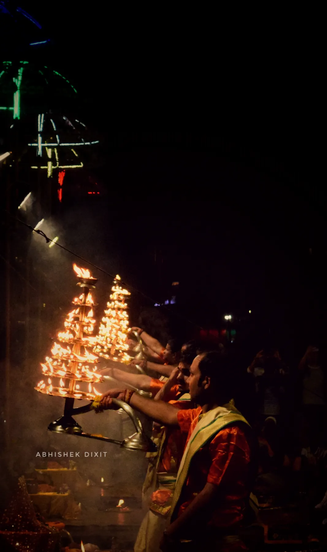 A many-tiered aarti lamp blazing at night