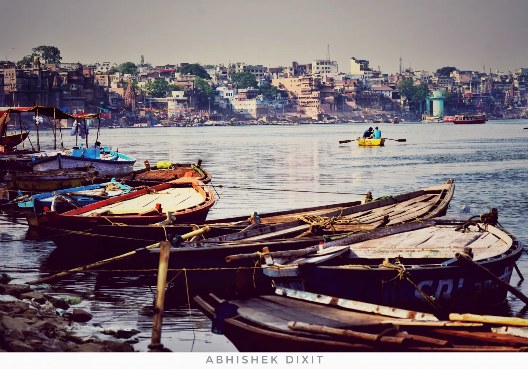 Boats moored on the Ganga with the city behind